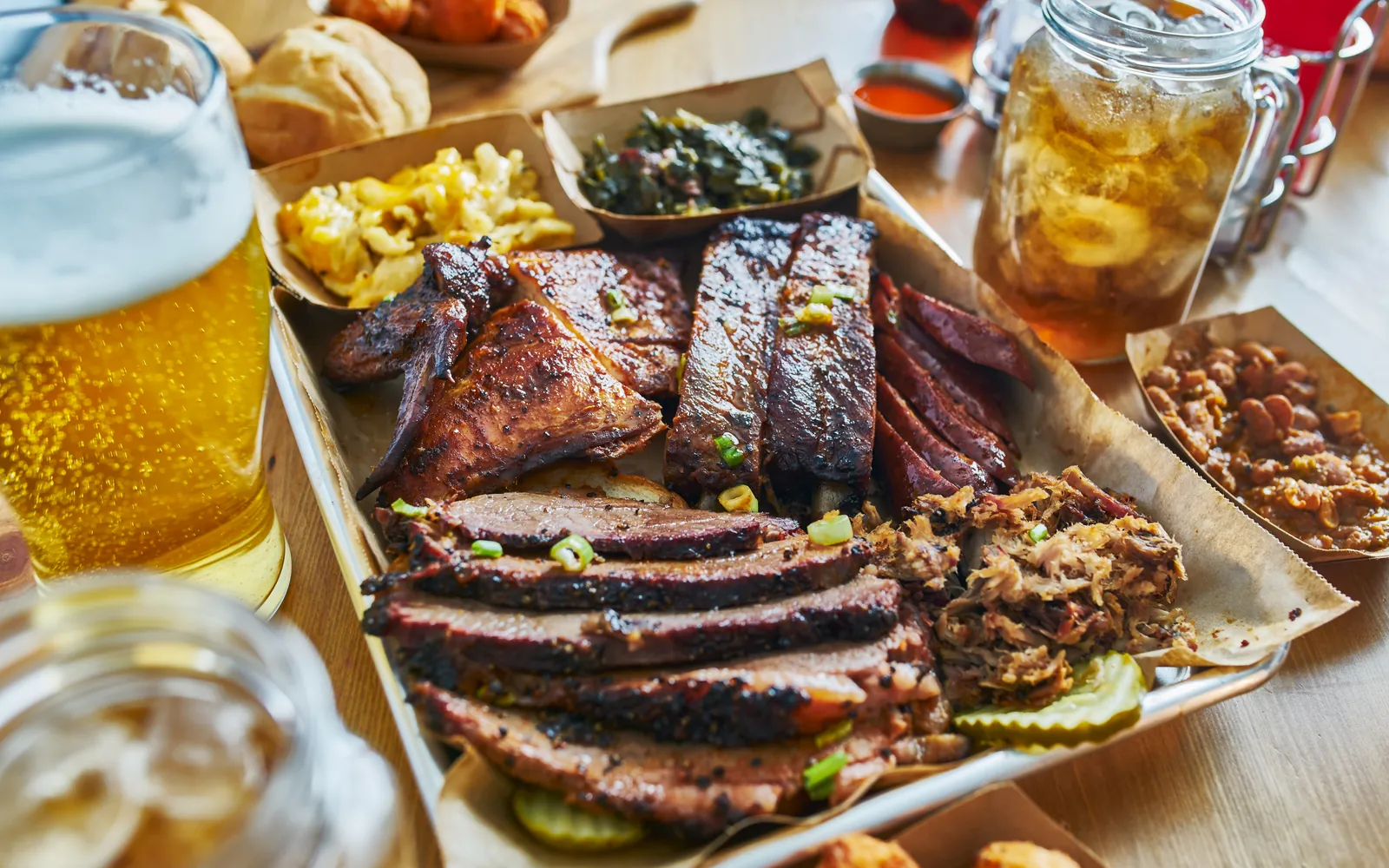 Texas-style barbecue tray with smoked brisket, ribs and sides